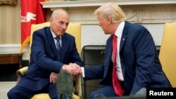 U.S. President Donald Trump shakes hands with John Kelly after he was sworn in as White House Chief of Staff in the Oval Office of the White House in Washington, July 31, 2017. (REUTERS/Joshua Roberts)
