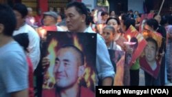 Tibetans in Delhi carrying posters of the Tibetans who self-immolated in China protest