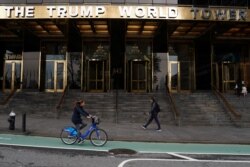 FILE - People pass by the Trump World Tower in the Manhattan borough of New York, New York, April 30, 2019.