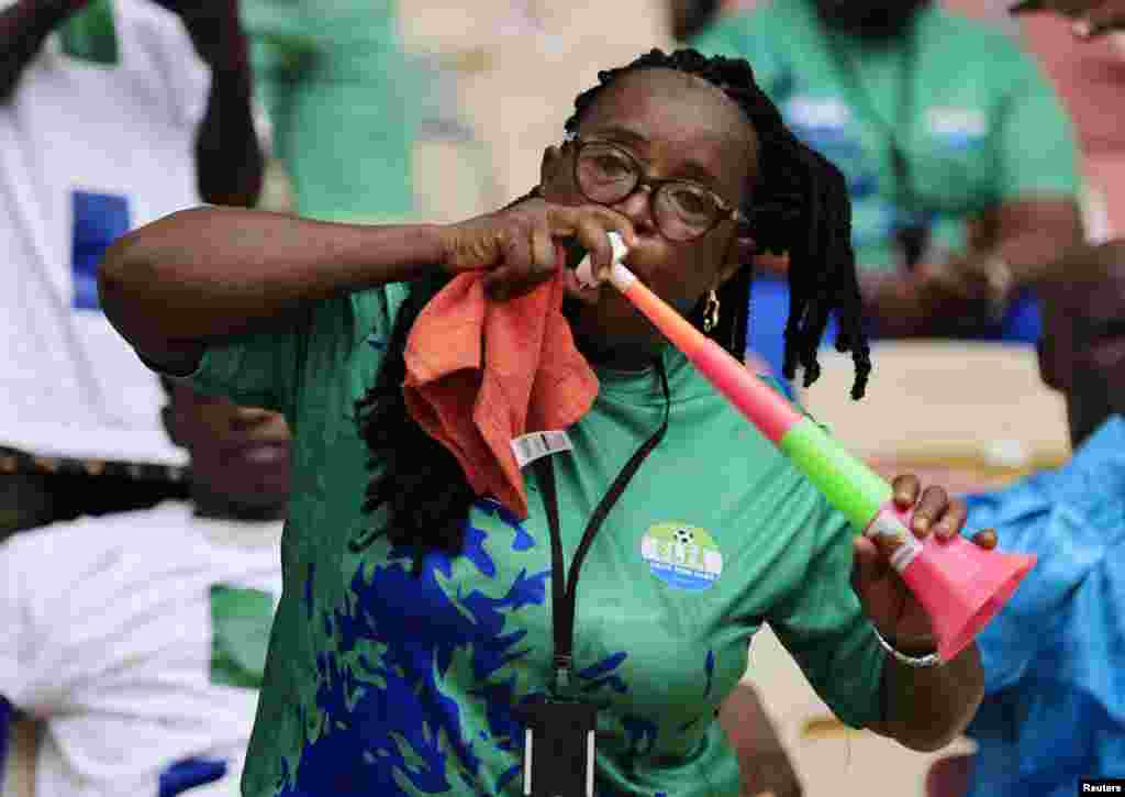 A Sierra Leonean fan cheers during the Algeria vs Sierra Leone match.