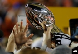 Denver players celebrate winning the Super Bowl in February 2016.