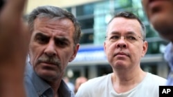 REPORT - Andrew Craig Brunson (left), evangelical pastor of Black Mountain, North Carolina, arrives at his home in Izmir, Turkey on July 25, 2018.