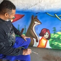 Mardi Gras artist Rene Pierre works on a piece of a house float, in New Orleans. (Photo courtesy of Rene Pierre)