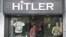 A customer walks out of a garment store named 'Hitler' in the western Indian city of Ahmedabad, September 4, 2012. 