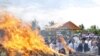 Cambodian officers burn some three tones of various drugs are seized in the nation wide of this country at the outskirt of Phnom Penh, Cambodia, Tuesday, June 2, 2009. 