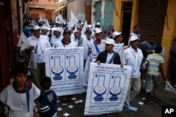 Supporters of the Islamist Justice and Development Party, known as the PJD, walk in the street of the old Medina during a campaign tour in Casablanca, Morocco, Oct. 1, 2016.