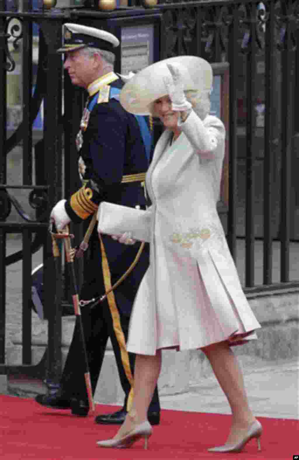 Britain's Prince Charles, left, and his wife Camilla, Duchess of Cornwall, arrive at Westminster Abbey at the Royal Wedding in London, April 29, 2011 (AP Photo/Gero Breloer)