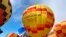 FILE - Hot air balloons are inflated during the annual Albuquerque International Balloon Fiesta in Albuquerque, N.M., Oct. 5, 2019.