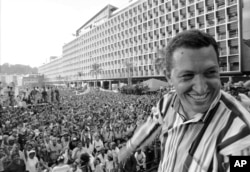 FILE - Hugo Chavez speaks at a 1998 Caracas event marking a Venezuelan coup six years earlier..