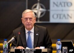 FILE - U.S. Secretary for Defense Jim Mattis addresses a round-table meeting in Brussels, June 8, 2018.