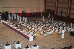 Taliban delegation attends the opening session of the peace talks between the Afghan government and the Taliban in Doha, Qatar, Sept. 12, 2020.