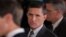 FILE - Then-White House national security adviser Michael Flynn, center, arrives at the White House in Washington, Feb. 13, 2017.