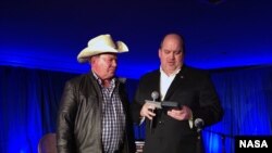 William Shatner is presented with NASA’s Distinguished Public Service medal by NASA's Bob Jacobs.