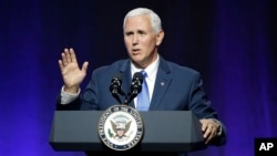 FILE - Vice President Mike Pence wraps up an address to a NGA session titled "Collaborating to Create Tomorrow's Global Economy," July 14, 2017, in Providence, R.I.