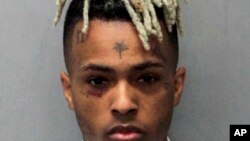 This undated mugshot released by the Miami- Dade Corrections & Rehabilitation Department shows rapper XXXTentacion. Authorities say troubled rapper-singer XXXTentacion has been fatally shot in Florida. 