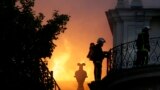 Firemen fight a blaze at the 17th-century Hotel Lambert in Paris, France.