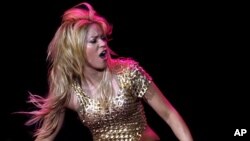 Colombian pop star Shakira performs during her concert as part of "The Sun Comes Out World Tour", at the Lluis Companys Olympic stadium in Barcelona May 29, 2011.