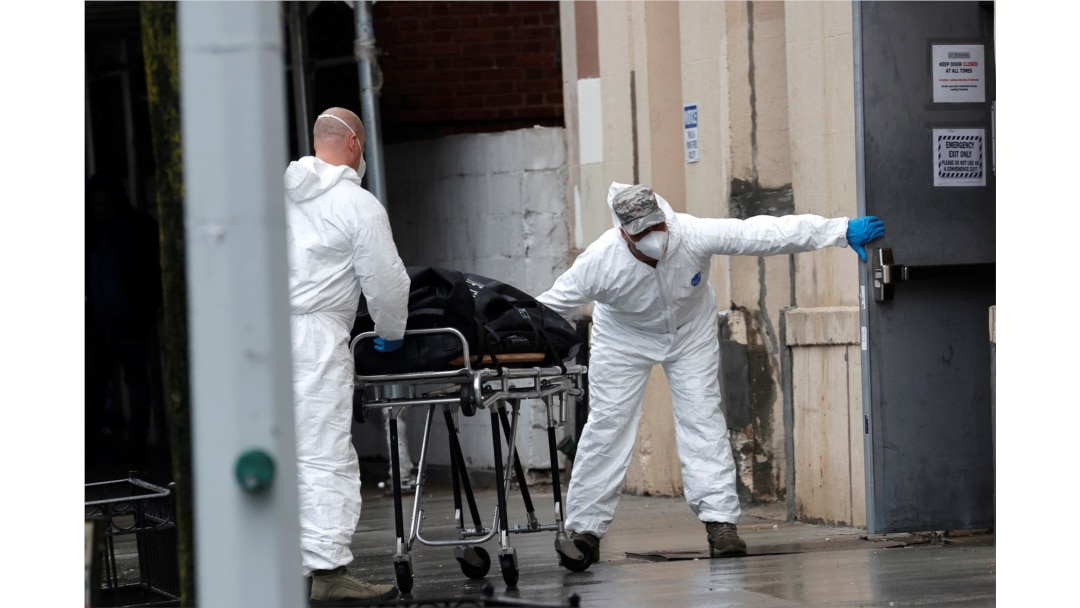 U.S. Army personnel remove the body of a deceased person from the The Riverside Premiere Rehabilitation & Healing Center senior facility on Manhattan's Upper West Side in New York City, April 13, 2020.