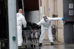 U.S. Army personnel remove the body of a deceased person from the The Riverside Premiere Rehabilitation &amp; Healing Center senior facility on Manhattan's Upper West Side in New York City, April 13, 2020.