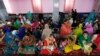 Afghan Hindu and Sikh families wait for lunch inside a Gurudwara, or a Sikh temple, during a religious ceremony in Kabul, Afghanistan, June 8, 2016.
