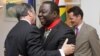 Zimbabwean Prime Minister Morgan Tsvangirai (C) is congratulated by the French Ambassador to Zimbabwe Francois Ponge (L) and his deputy Dietmar Petrausch after receiving the Commander of the Legion of Honor in Harare, Zimbabwe, August 21, 2012.