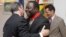 Zimbabwean Prime Minister Morgan Tsvangirai (C) is congratulated by the French Ambassador to Zimbabwe Francois Ponge (L) and his deputy Dietmar Petrausch after receiving the Commander of the Legion of Honor in Harare, Zimbabwe, August 21, 2012.