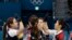 South Korea's women's curling team celebrate after beating Russian athletes during their match at the 2018 Winter Olympics in Gangneung, South Korea, Feb.21, 2018. The team known as the "Garlic Girls" came into the Pyeongchang Games as the underdog. Now they're No. 1 in the rankings.