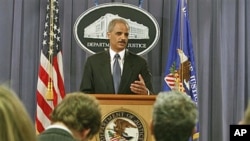 Attorney General Eric Holder gestures during a news conference at the Justice Department in Washington, where he announced plans to try avowed 9/11 mastermind Khalid Sheikh Mohammed and four alleged henchmen before a military commission, April 4, 2011