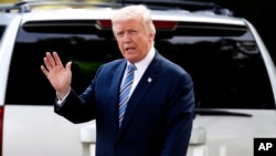 FILE - President Donald Trump waves as he walks to Marine One on the South Lawn of the White House.