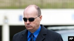 Lt. Brian Rice, seen in this March 3, 2016 photo, leaves the Maryland Court of Appeals in Annapolis, Md. A police disciplinary board cleared Rice, the highest-ranking officer involved in Gray's arrest, on all administrative charges on Friday, Nov. 17, 2017.