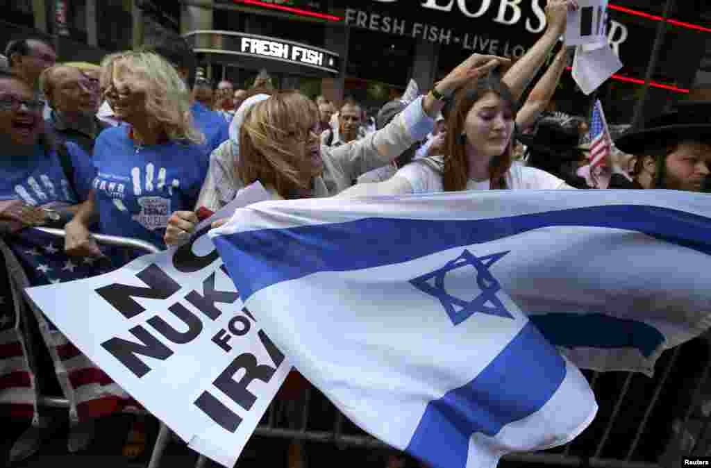 Protestors shout slogans as they demonstrate with thousands of others during a rally opposing the nuclear deal with Iran in Times Square, New York City, July 22, 2015.