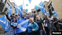 'Yes' campaigners cheer during a rally in Glasgow, Scotland, Sept. 17, 2014. 