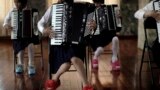 School girls perform a song during an accordion class in Pyongyang, North Korea. 