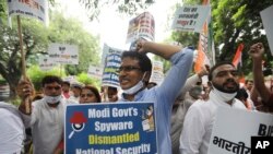 FILE: Congress party workers shout slogans during a protest accusing Prime Minister Narendra Modi's government of using military-grade spyware to monitor political opponents, journalists and activists in New Delhi, India, July 20, 2021.