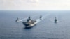 參加「鐵拳24」的美國海軍兩棲攻擊艦「美利堅號」(USS America)(中)2020年4月18日與澳洲大型護衛艦帕拉馬塔號(HMAS Parramatta)，邦克山號航空母艦(USS Bunker Hill)和巴里號驅逐艦(USS Barry DDG-52)在南中國海海域舉行演習。