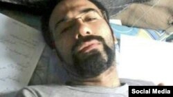 FILE - Iranian citizen-journalist Soheil Arabi is seen in an undated photo from a prison in Iran.