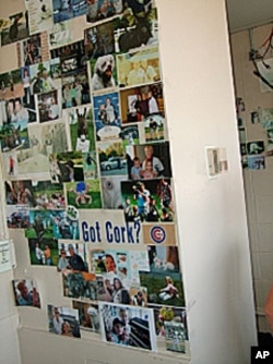 Pictures of fans and their families grace the wall behind where Nancy Faust plays the organ at White Sox baseball games.