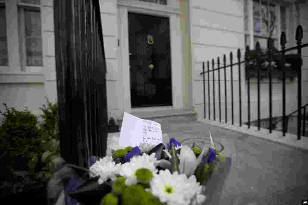 A floral tribute is seen after being laid outside the home of the late former British Prime Minister Margaret Thatcher in London. 