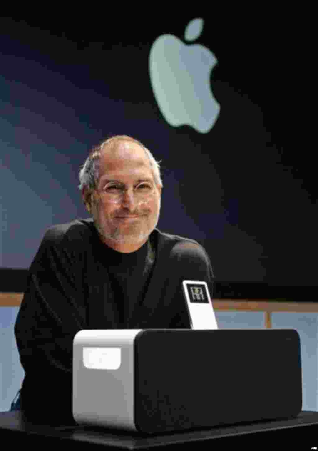 Apple Computer Inc. CEO Steve Jobs smiles next to the new Apple iPod Hi-Fi speaker system for its iPod player at an unveiling at Apple headquarters in Cupertino, Calif., Tuesday, Feb. 28, 2006. (AP Photo/Paul Sakuma)