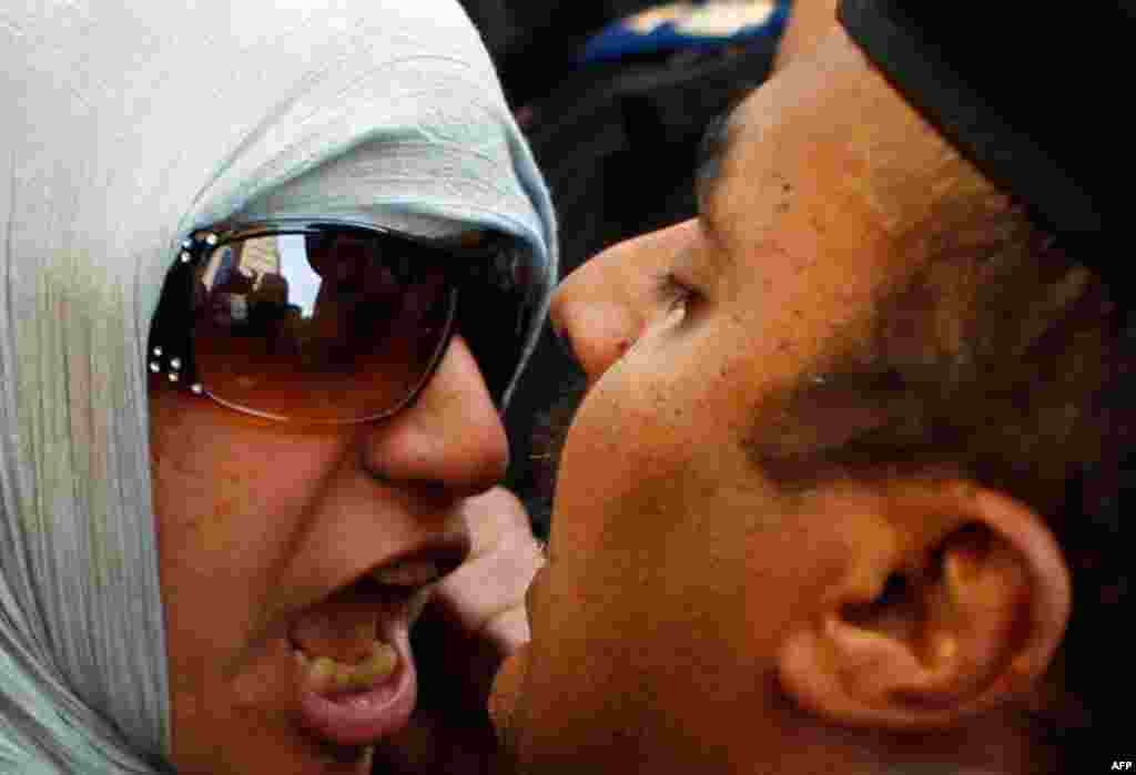 January 26: An anti-government protester clashes with a policeman in Cairo. (Reuters/Amr Abdallah Dalsh)