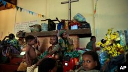 Muslim women and children take refuge in St. Pierre Church in Boali, Central African Republic, on January 23 as anti-Balaka Christians and Seleka militias loot and kill civilians.