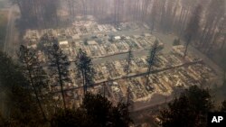 Residences leveled by the wildfire line a neighborhood in Paradise, Calif., on Nov. 15, 2018. 