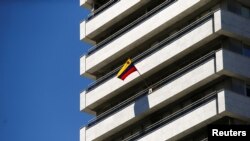 A Venezuelan flag flies on a balcony of the Venezuelan embassy in Madrid, Spain, May 15, 2018. 