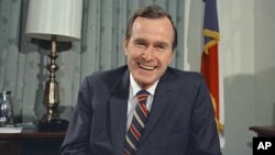 FILE- George H.W. Bush, the newly appointed U.S. Ambassador to the United Nations, Dec. 18, 1970.