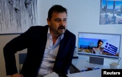Real estate agent Cenk Tanman, speaking from his office in Istanbul, March 28, 2017, founded a website for people wanting to invest in Greece as a way to gain residency permits.