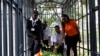 FILE - Members of Emergency Rescue Services place flowers during the reopening ceremony of the DusitD2 hotel, in Nairobi, Kenya, July 31, 2019, six months after the terror attack that left 21 people dead.