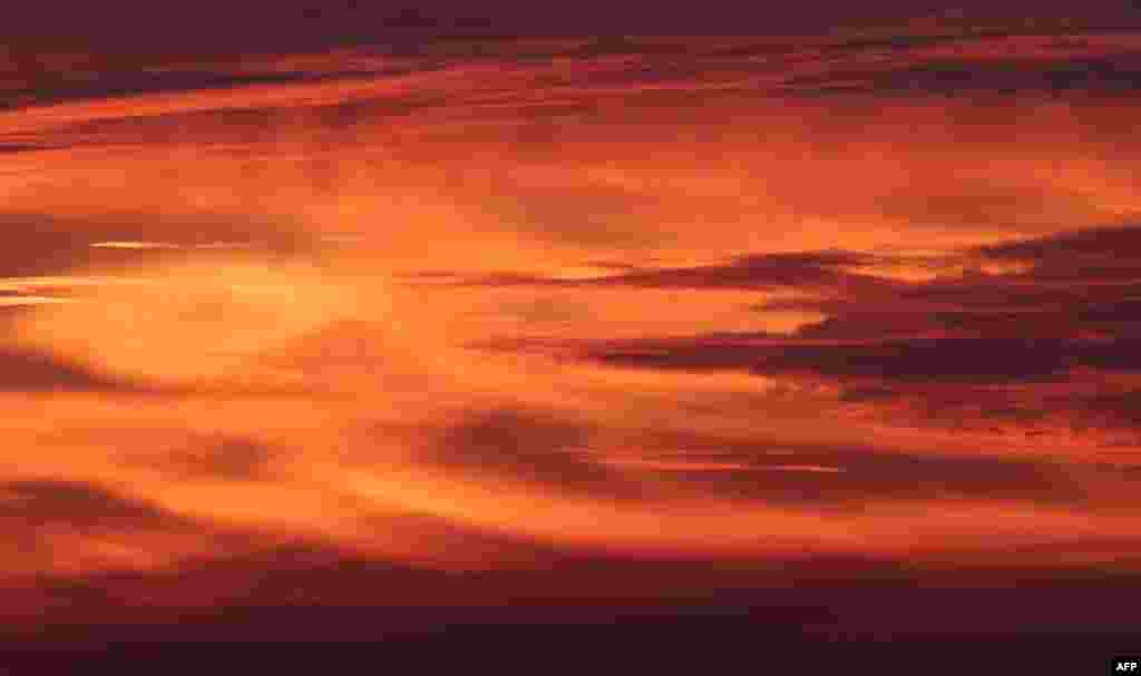 The sun rises over the Kraichgau mountains pictured in Gaiberg near Heidelberg, southern Germany.