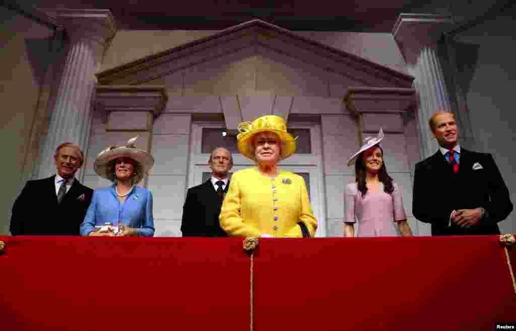 Madame Tussauds unveils its new royal balcony experience featuring wax figures of Britain's Prince Charles and his wife Camilla, Britain's Queen Elizabeth and Prince Philip and Britain's Prince William, Duke of Cambridge and Catherine, Duchess of Cambridg