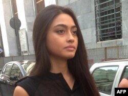 FILE - Italian beauty queen Ambra Battilana, pictured in Milan in July 2013, says she felt pressured to sign a nondisclosure agreement after having accused media mogul Harvey Weinstein of groping her in 2015.