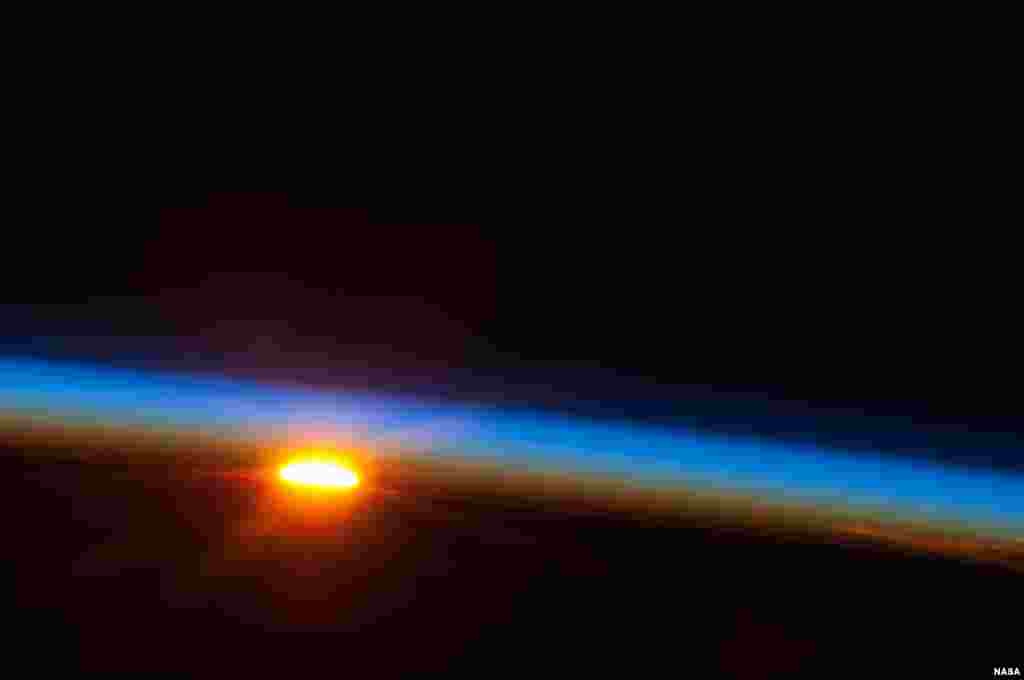 The sun is about to come up over the South Pacific Ocean in this colorful scene photographed between 4 and 5 a.m. local time, May 5, 2013, by one of the Expedition 35 crew members aboard the Earth-orbiting International Space Station. (Photo released on May 9, 2013)